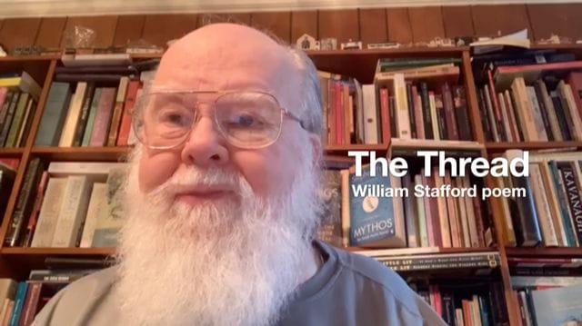 Photo of John O'Brien reading a poem