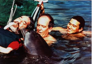 Ed Roberts Kissing a dolphin