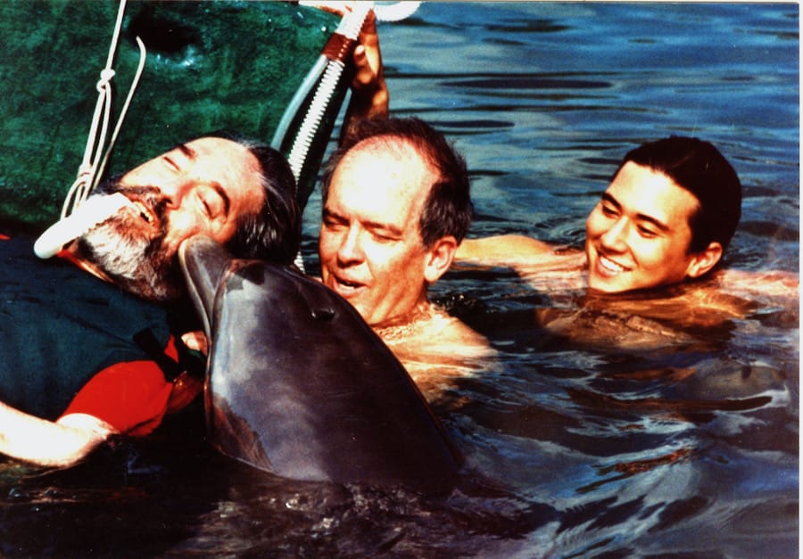 Ed Roberts Kissing a dolphin