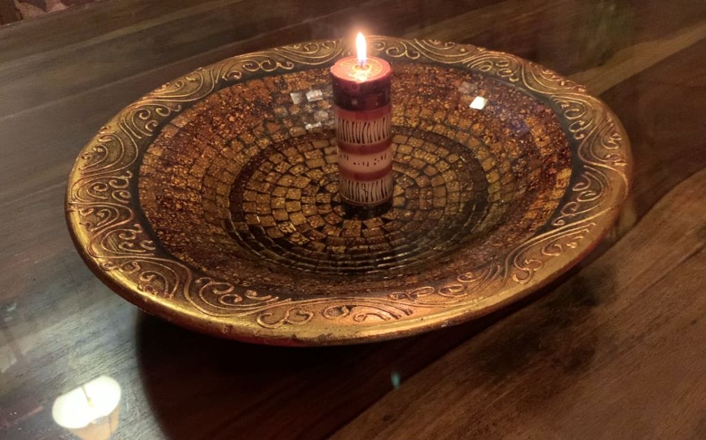 Image of A candle in the water - in a large tiled bowl